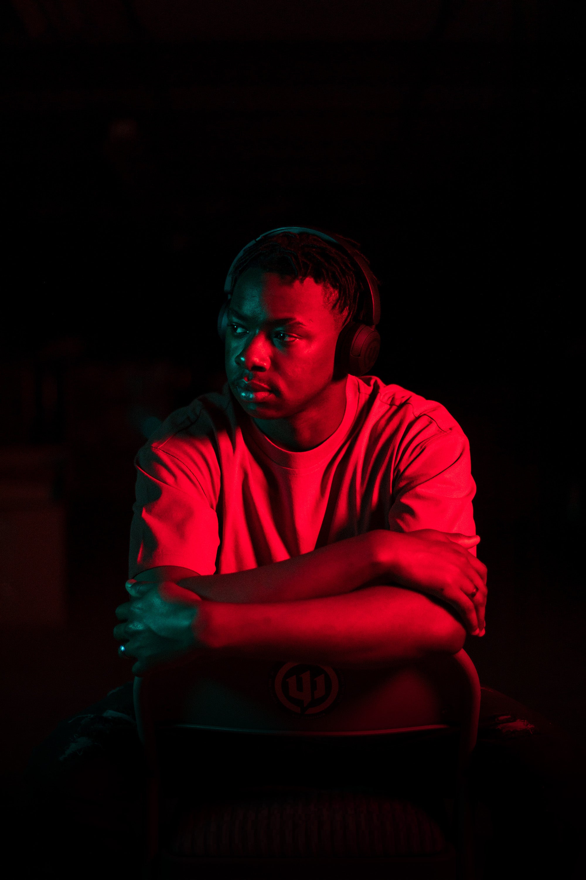 Hum 500x Headphone worn by guy in red light.