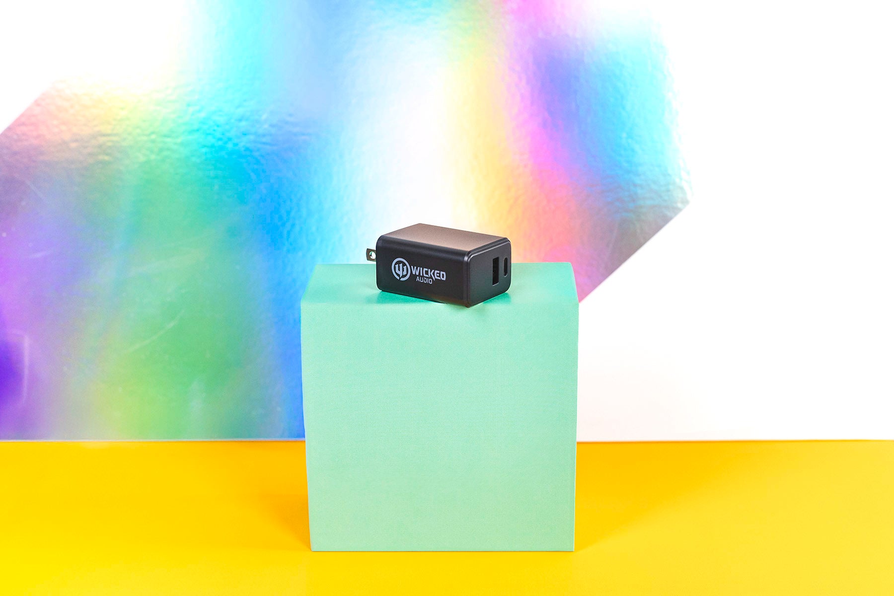 Dual Port Wall Charger in Black on colorful background