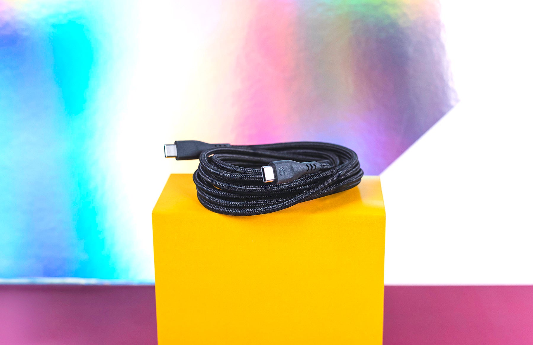 8ft black charging cable coiled on yellow box