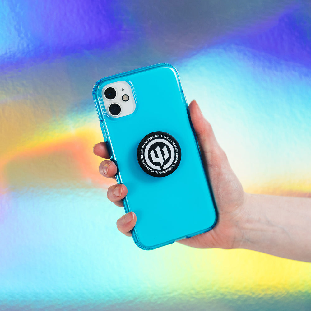 PopSocket on blue phone held in someone's hand in front of holographic background