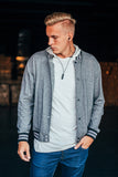 Male model wearing raider earbuds. 